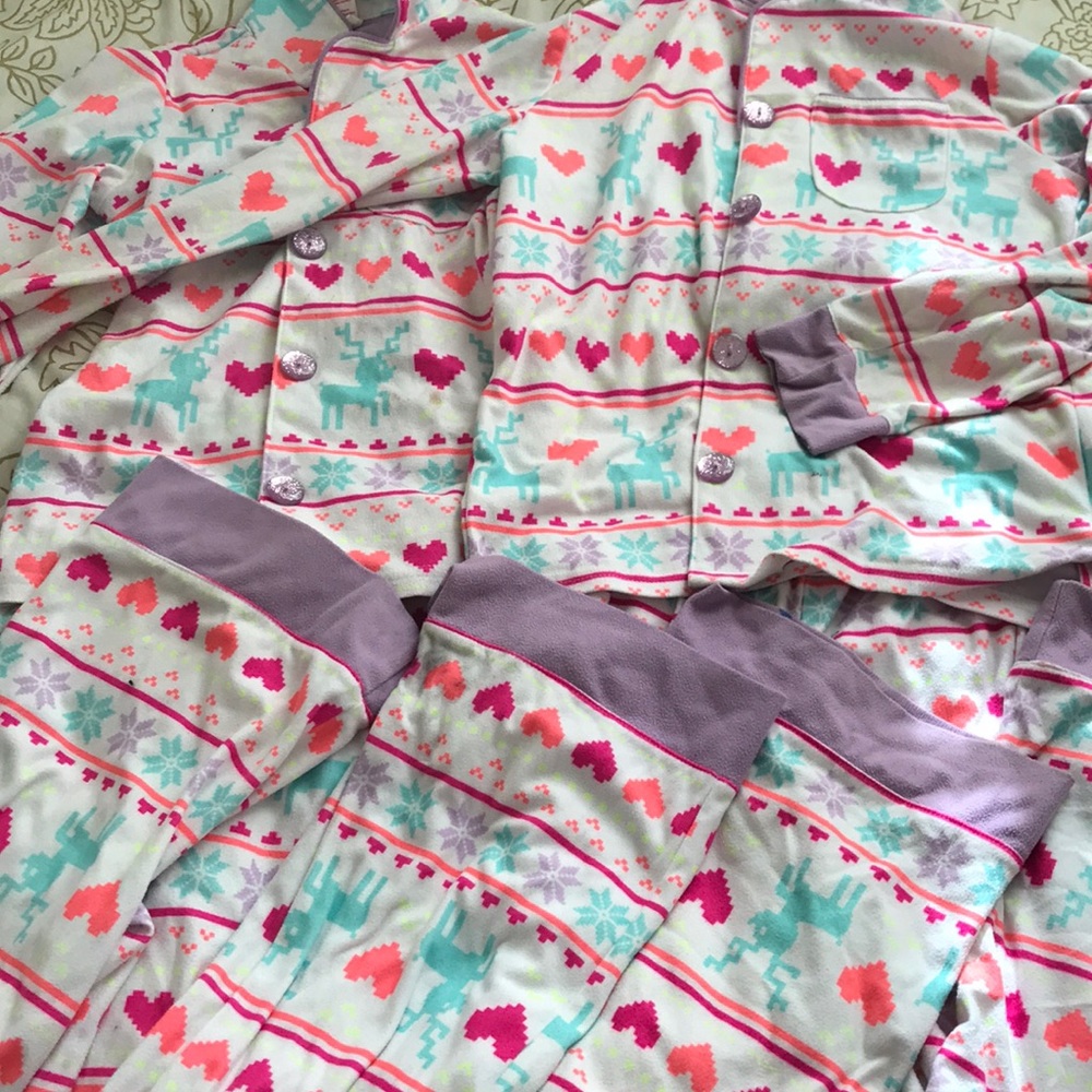 This is a set of 2 Christmas pjs in sixes 7 and 8.